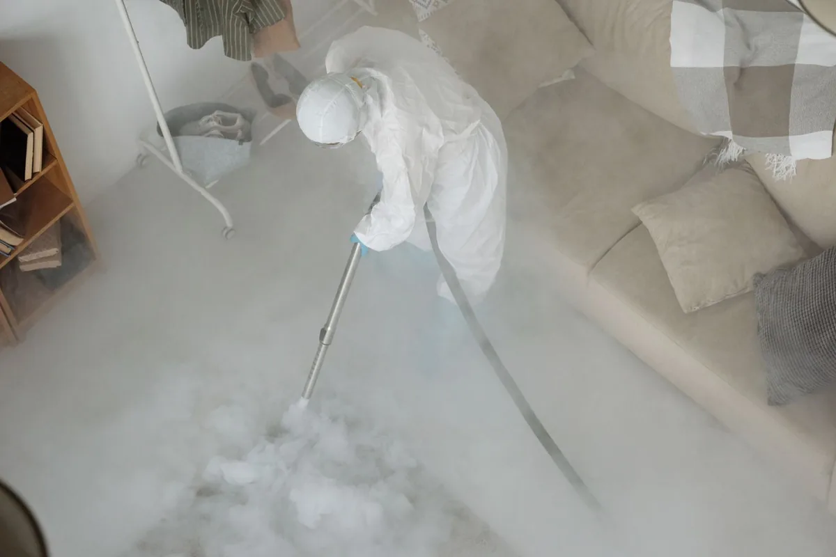 Biohazard cleanup technician in protective equipment, Louisville, TN